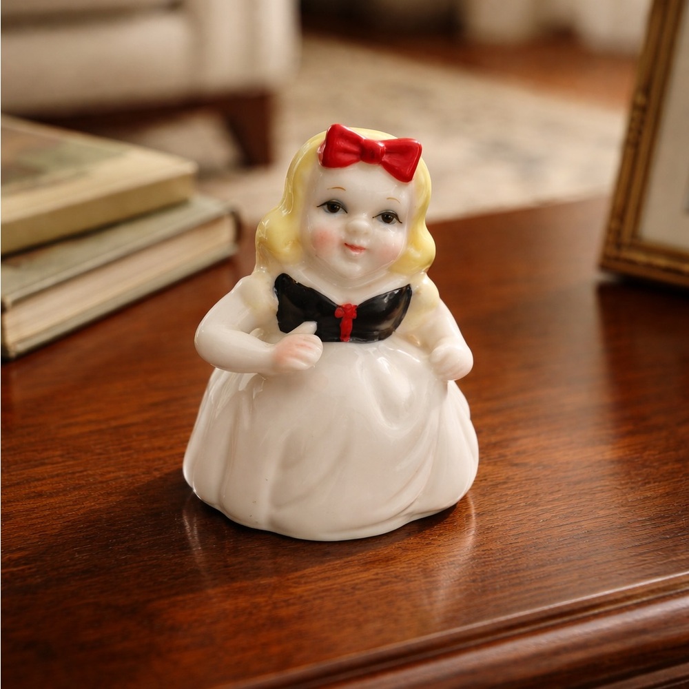Snow White Porcelain Figurine with Red Bow and Black Dress